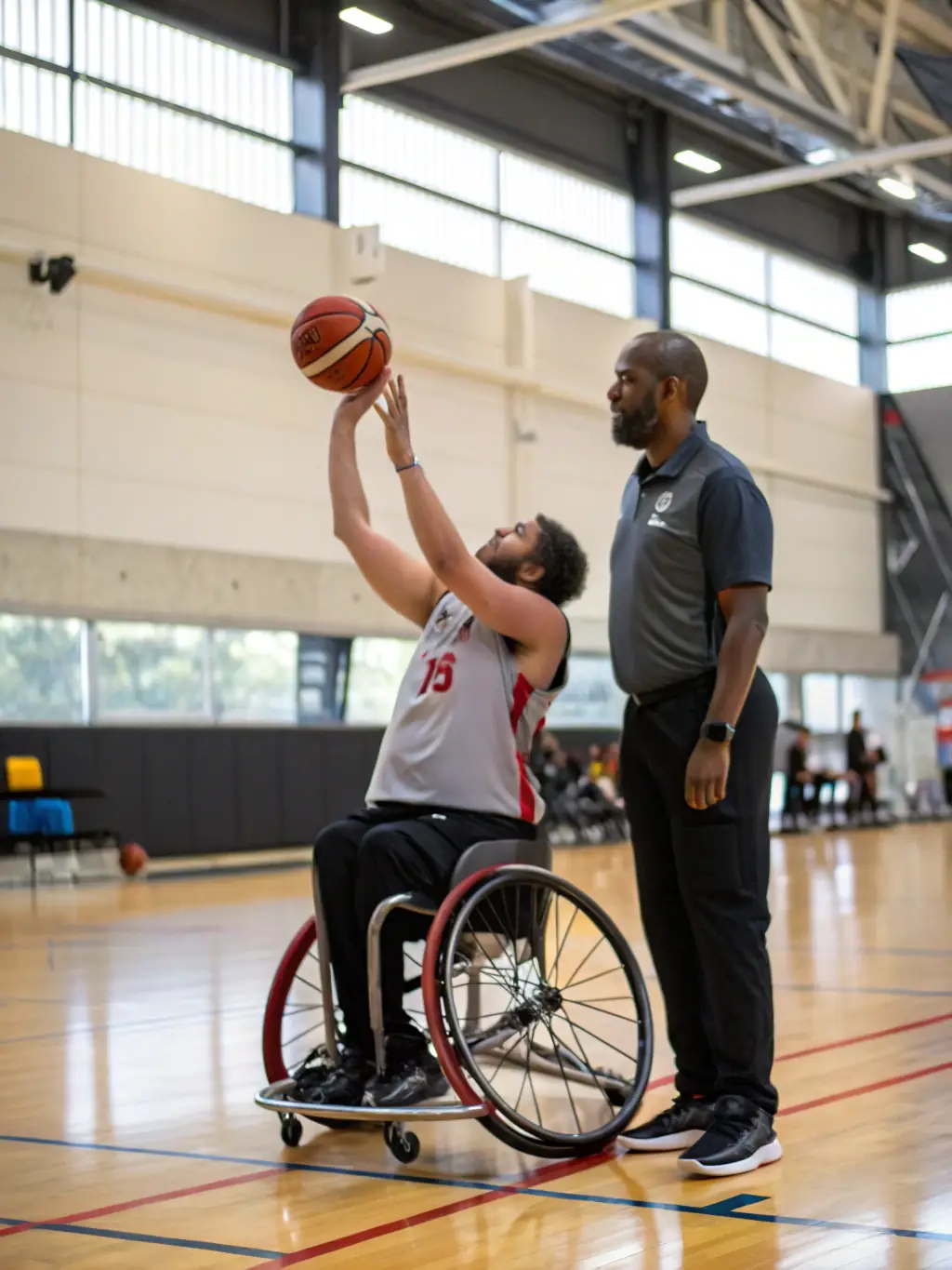 People with disabilities participating in adapted sports, such as wheelchair basketball, in a gymnasium, highlighting the inclusive sports programs.